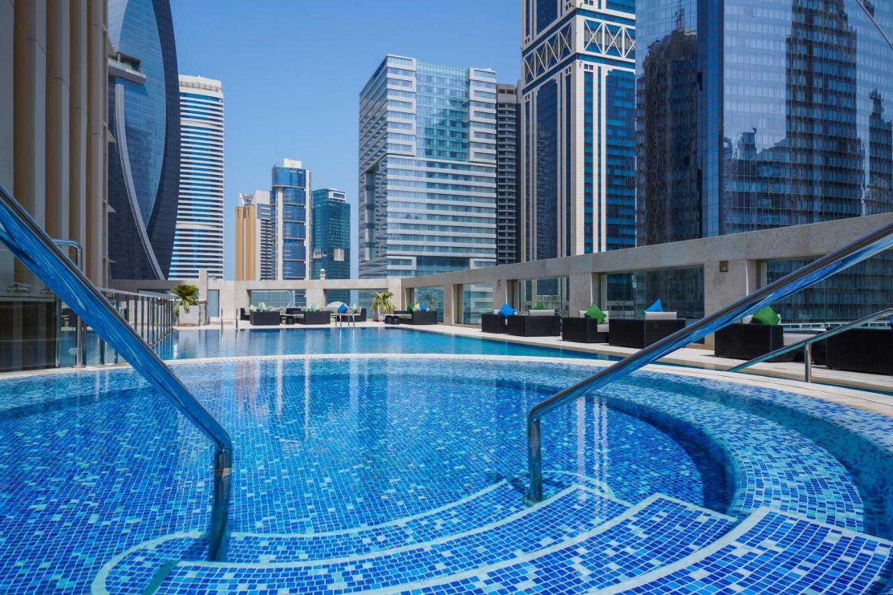 Wyndham Grand Doha West Bay Beach Экстерьер фото The swimming pool at the hotel